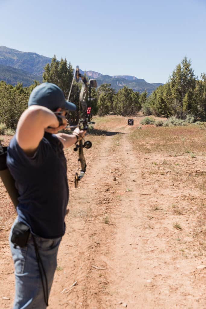 Toes pointed perpendicular to target